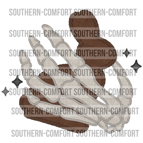 Skellie hand holding a chocolate bunny Png